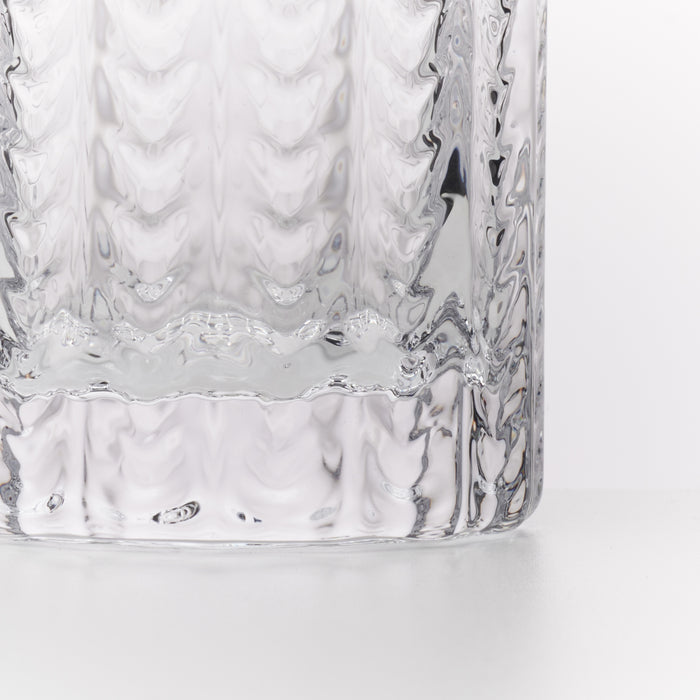 Clear glass Collins glasses with textured quilted pattern on exterior surface.
