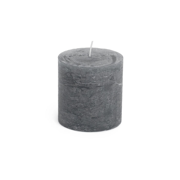 Grey cylindrical pillar candle with white wick, textured finish surface.