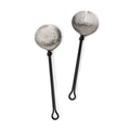 Two serving spoons with hammered silver bowl heads and black handles with loop ends.