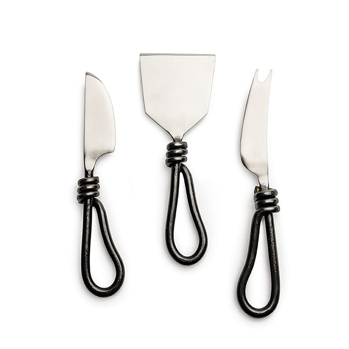Three stainless steel cheese knives with black twisted handles and decorative wrapping near the blade.