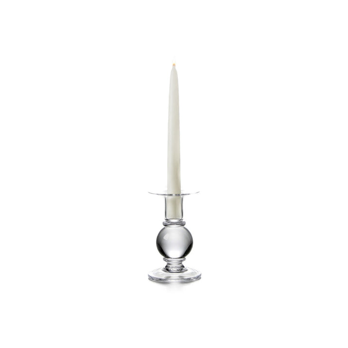 Clear glass candlestick with spherical base holding a tall cream taper candle.