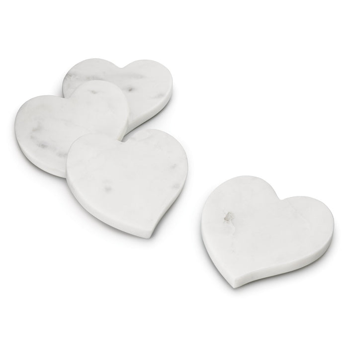 Four white marble heart-shaped coasters with veining detail displayed in a grouped arrangement.