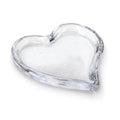 Clear glass tray in heart shape with shallow sides and textured edges.