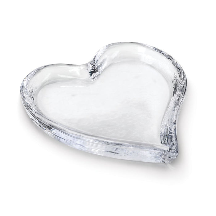 Clear glass tray in heart shape with shallow sides and textured edges.
