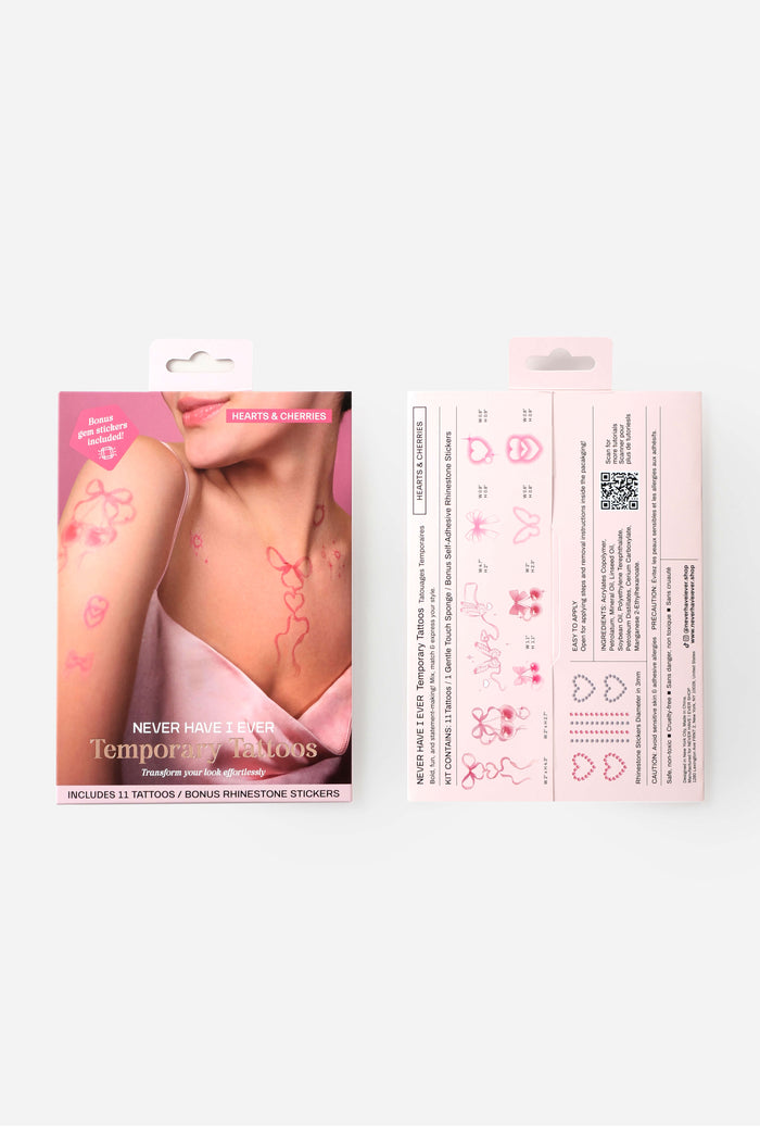 Pink temporary tattoos: bows, hearts, cherries, butterfly. Includes rhinestone stickers. Never Have I Ever branding.