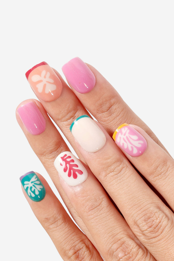 Henri Matisse Square Snow Flowers nails: abstract floral designs on square press-ons in pink, white, teal, peach.
