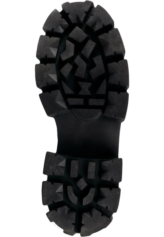 A pair of high-laced combat boots, perfect for military style enthusiasts and those in need of tactical lace-up boots for combat-ready footwear, these high-top battle boots are a bold and sturdy choice.