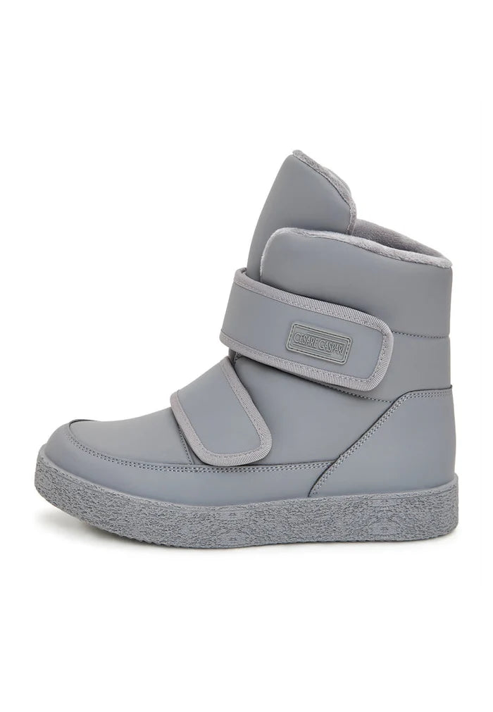 A pair of grey high-top winter boots with Velcro straps, ideal for cold weather and winter footwear.
