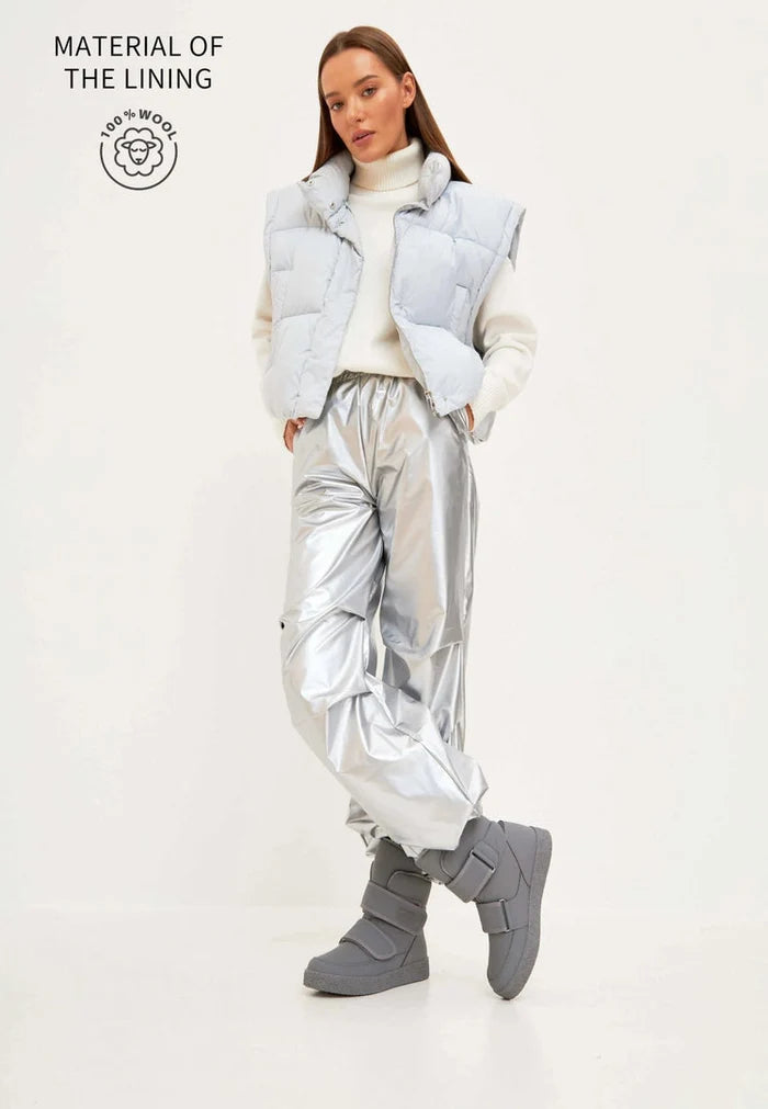 A pair of grey high-top winter boots with Velcro straps, perfect for cold weather and snowy days.