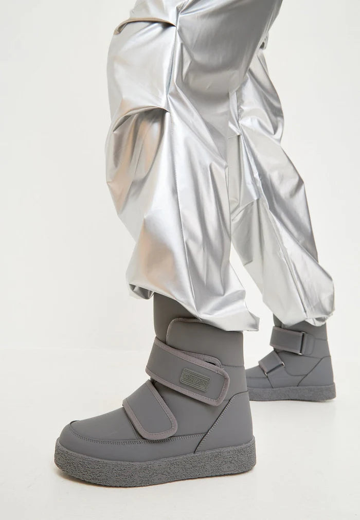 A pair of grey high-top winter boots with velcro straps, perfect for cold weather and stylish winter footwear.