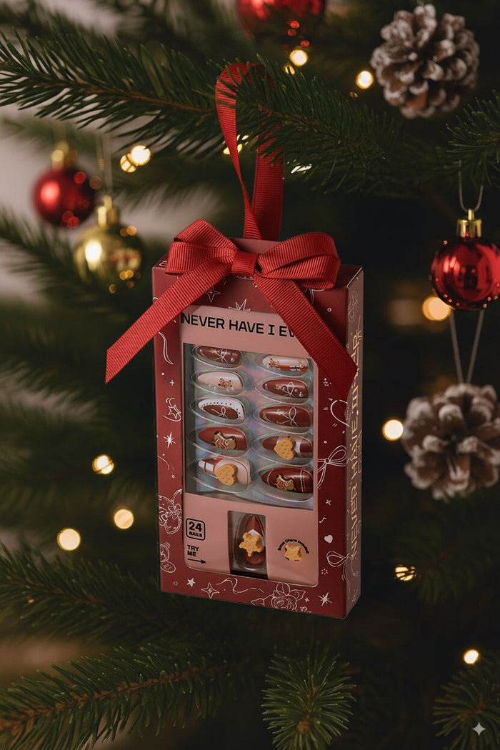 BEAR YUMMY almond press-on nails gift box with red ribbon, decorated with festive Christmas tree and ornaments.