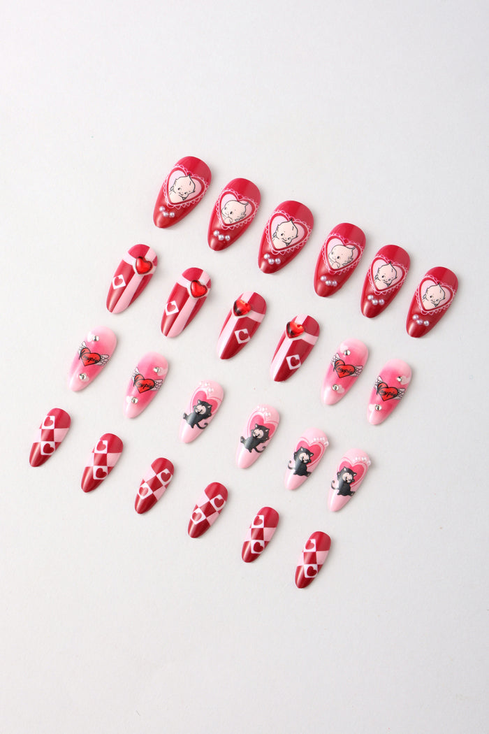 Kewpie cat press-on nails with heart and checkerboard designs in pink and red