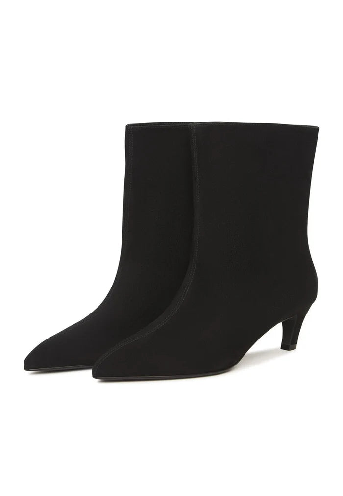 A stylish pair of black kitten heel ankle boots, perfect for any fashion-forward woman looking for trendy dolly style boots.
