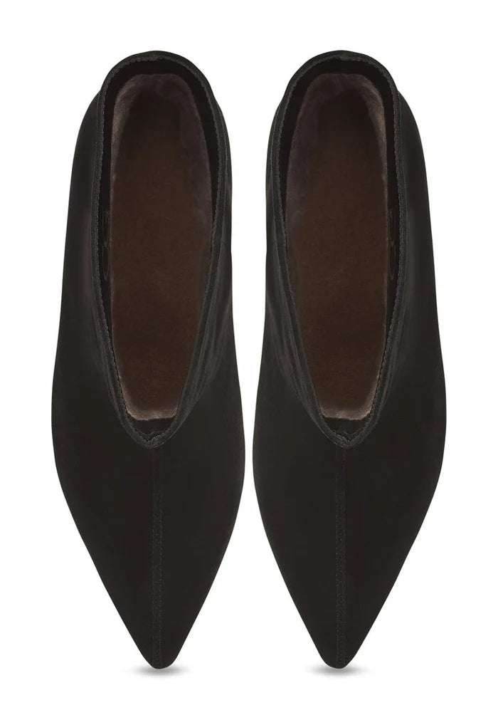 A trendy pair of black kitten heel ankle boots, perfect for women who love dolly style footwear and fashionable boots.