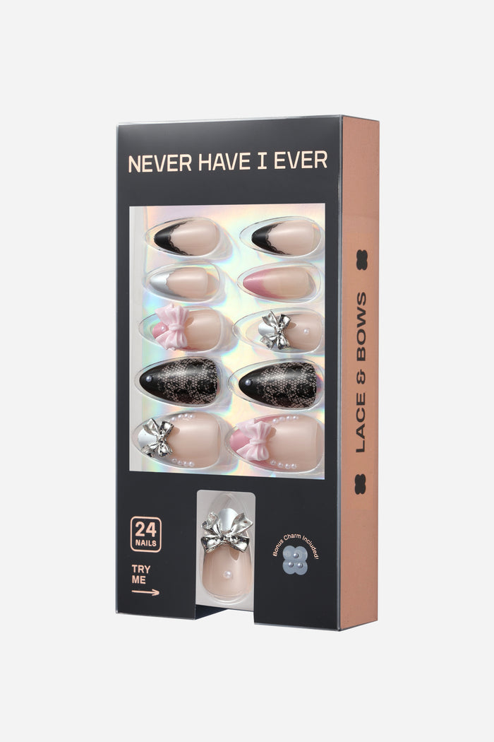 Never Have I Ever Lace and Bows short almond press-on nails with bow and pearl embellishments.