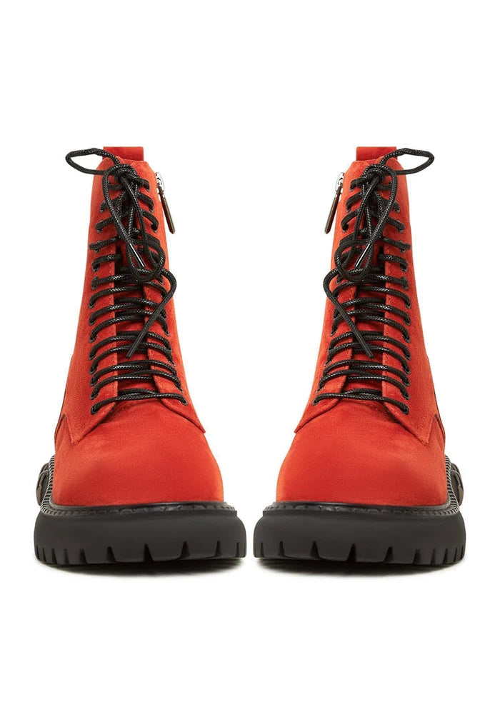 A pair of stylish red lace-up combat boots with a chunky sole, perfect for women's fashion looks.