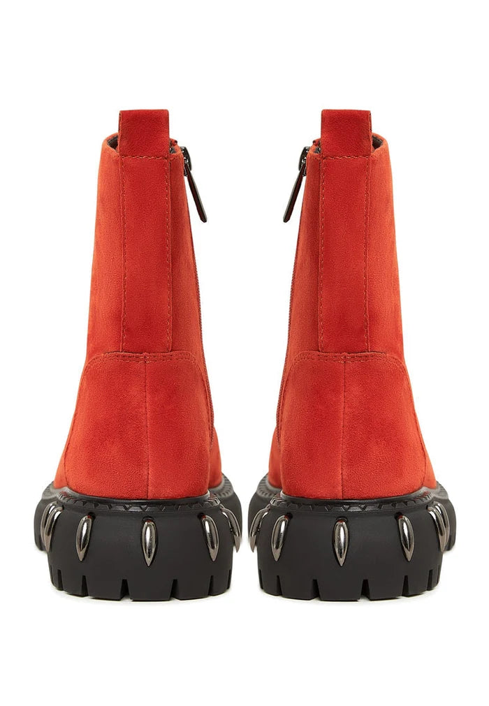 A stylish pair of red lace-up combat boots with chunky soles, perfect for women's fashion.