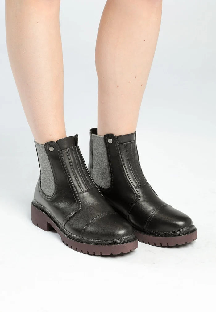 A stylish pair of ankle boots crafted from high-quality leather, perfect for any designer shoe collection.