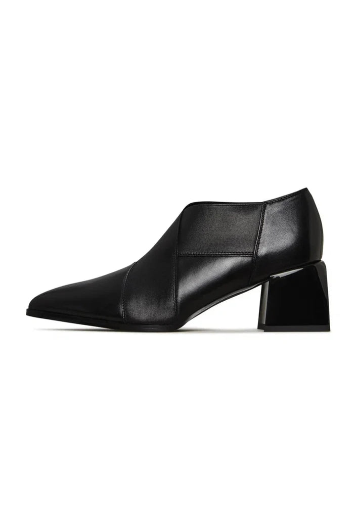 A stylish pair of high-quality leather block heel pumps, perfect for fashionable women.