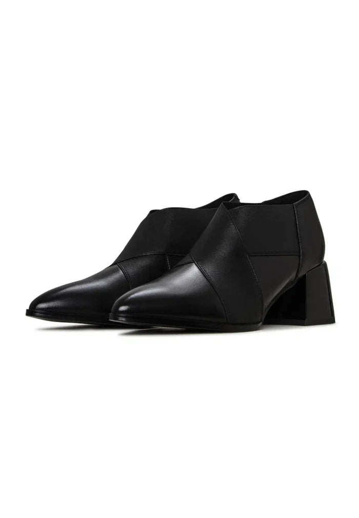 A stylish pair of high quality leather block heel pumps, perfect for fashionable women.