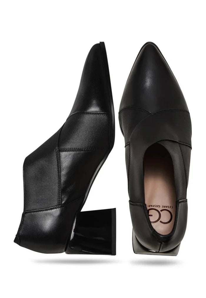 A pair of stylish block heel leather pumps, perfect for women who appreciate high-quality and fashionable footwear.