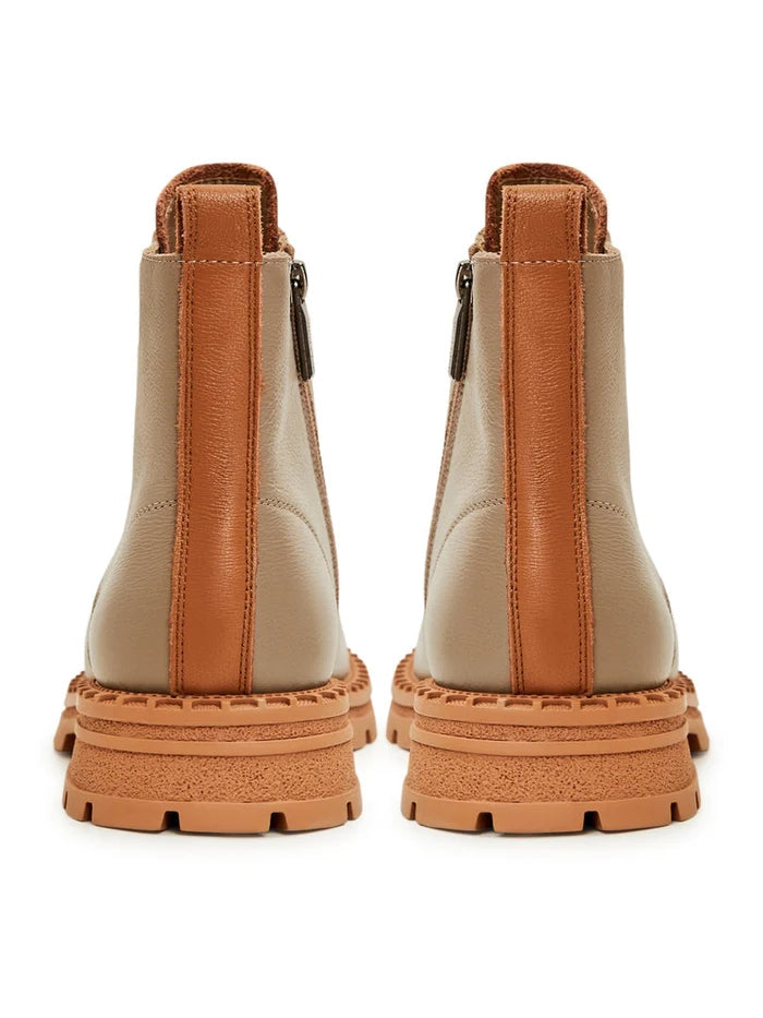 A stylish pair of women's beige lace-up leather ankle boots, perfect for adding a touch of fashion to any outfit.