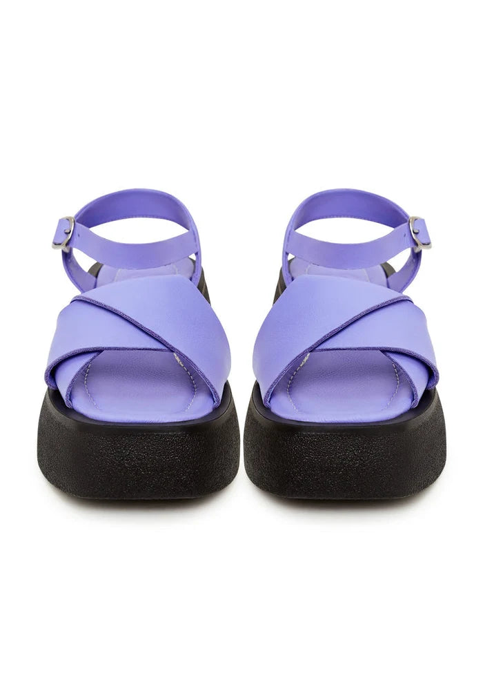 A pair of stylish lilac leather platform sandals for women, featuring high heels and perfect for summer outings.