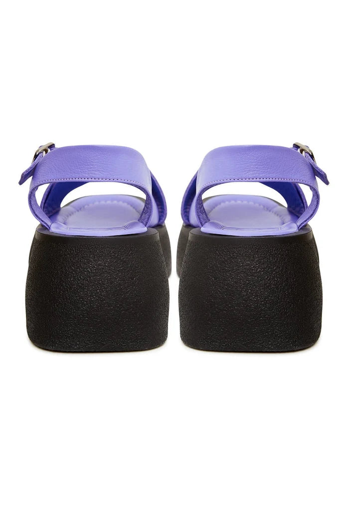 A pair of stylish lilac leather platform sandals for women, featuring high heels perfect for summer wear.