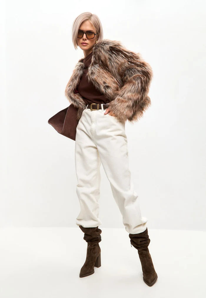 Stay warm and stylish with this luxe brown faux fur jacket, the perfect eco-friendly fashion choice for winter.
