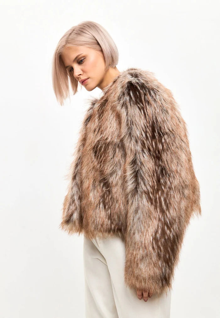 Stay cozy and stylish this winter with a luxe brown faux fur jacket - the perfect eco-friendly fashion choice for staying warm in the cold weather.
