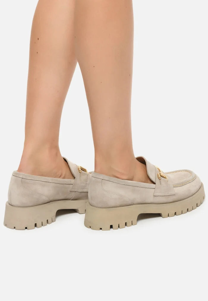 A stylish image showcasing Luxe Glide Gold-Bit Loafers by Josephine Beige, the ultimate choice for women seeking designer luxury in beige leather slip-on shoes with exquisite gold-bit detailing.