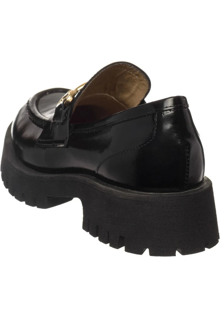 A stylish and sophisticated collection of women's shoes, including Luxe Glide Gold-Bit Loafers, Josephine Black loafers, and Luxe Glide Black shoes with gold-bit detailing. Perfect for adding a touch of elegance to any outfit.
