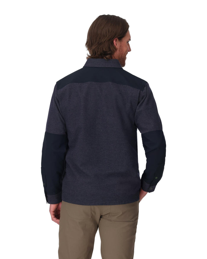 Person wearing a dark blue pullover with a white background
