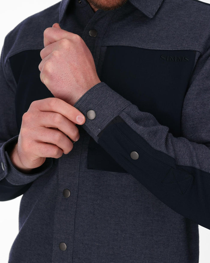 Navy and gray button-up shirt with a brand logo on a white background