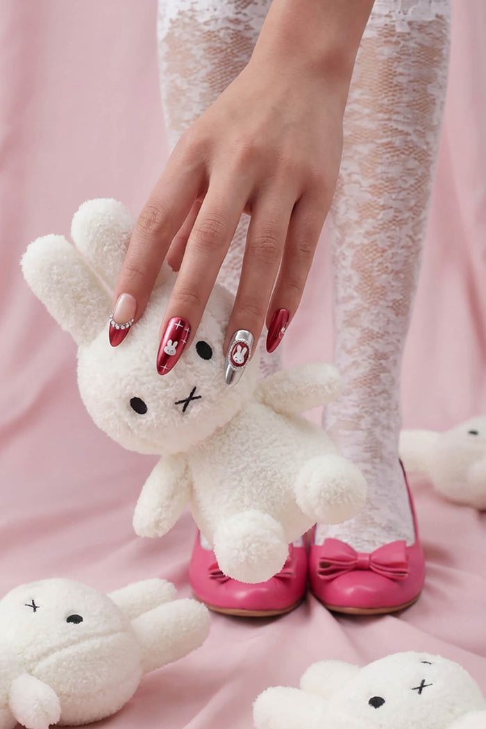 Burgundy Miffy almond press-on nails with Miffy character designs and silver accent nail.