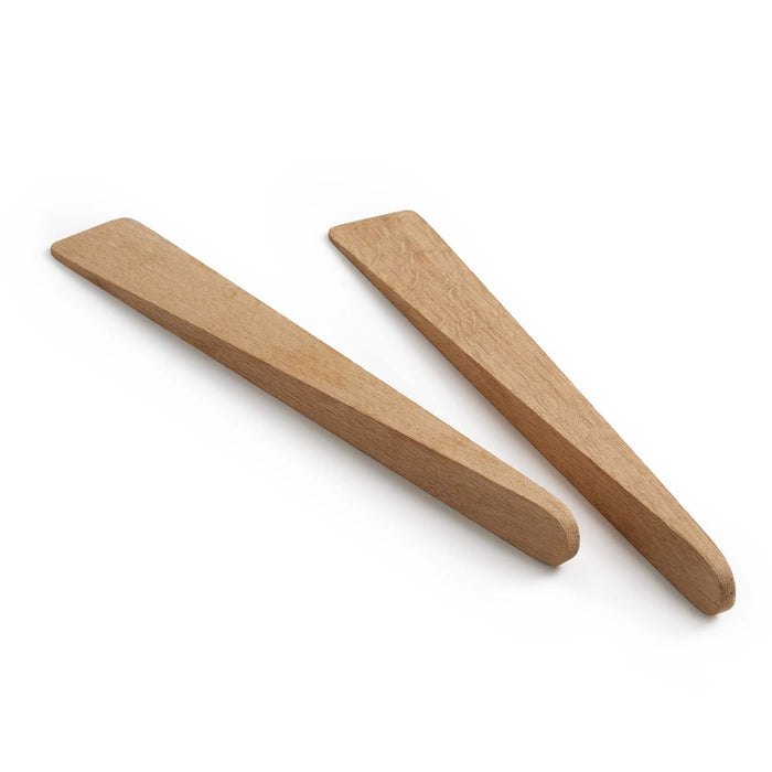 Two oak wood salad servers with flat, tapered bowls and rounded handles.