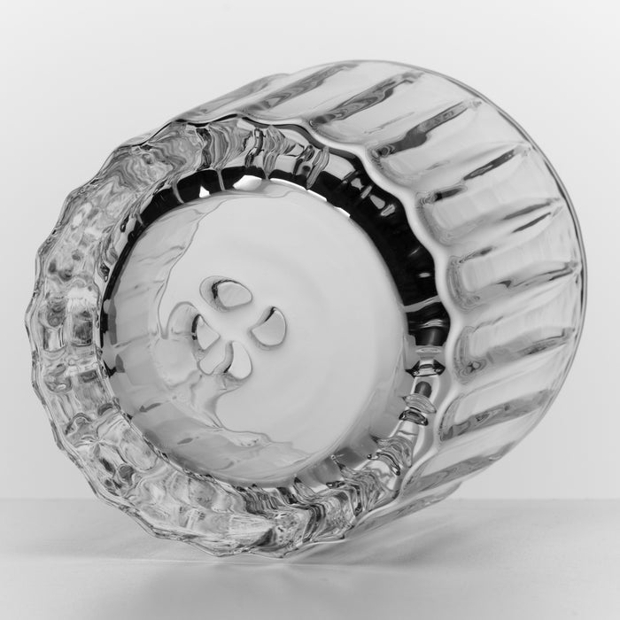 Clear glass double old-fashioned tumbler with textured handle and ribbed sides, shown from above.