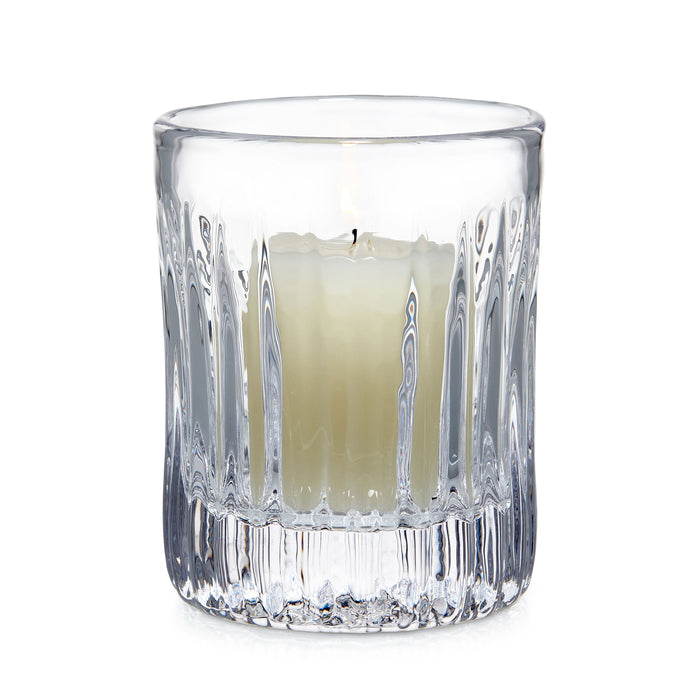 Clear crystal hurricane candle holder with vertical ribbed pattern and cream-colored pillar candle inside.