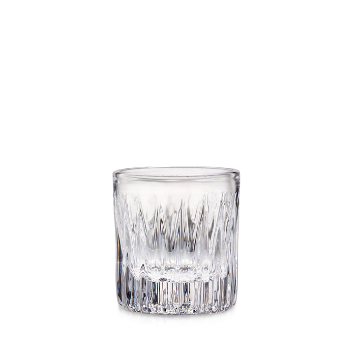 Clear glass tumbler with vertical cut pattern design, empty and ready for use.