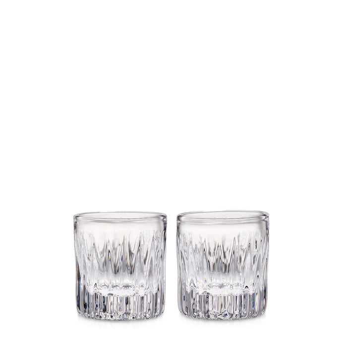 Two clear cut crystal whiskey glasses with geometric pattern design.