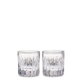 Two clear cut crystal whiskey glasses with geometric pattern design.