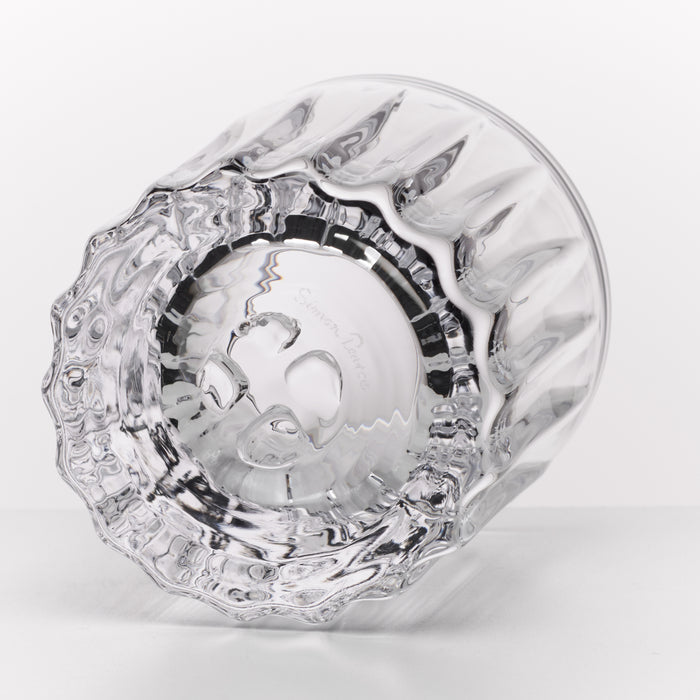 Two clear glass whiskey rocks glasses with textured base and black band detail, shown from overhead angle.