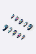 Set of dark blue almond-shaped press-on nails featuring colorful floral designs with pink, yellow, and teal accents.
