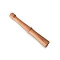 Wooden muddler with rounded head and tapered handle for crushing and mixing ingredients in cocktails.