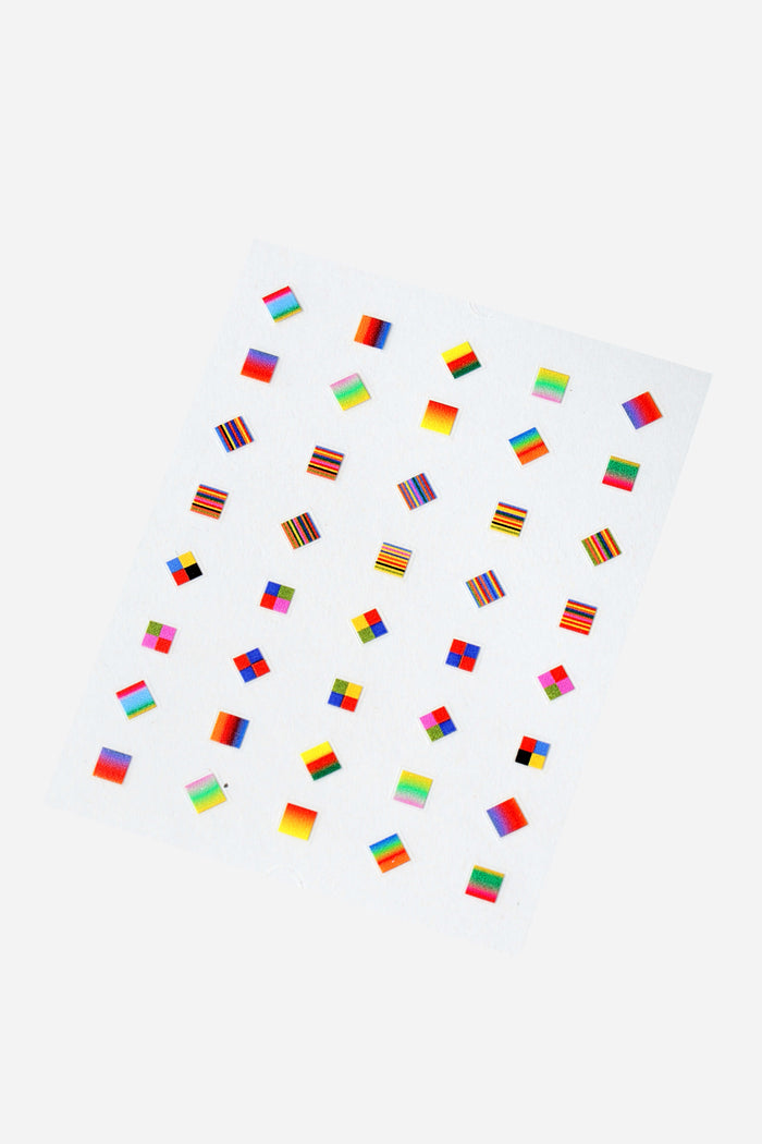 Sheet of square nail stickers featuring colorful abstract patterns and gradients.