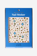 Sirrah Archive nail stickers with vintage designs: lockets, moons, keys, birds, and florals on blue packaging.