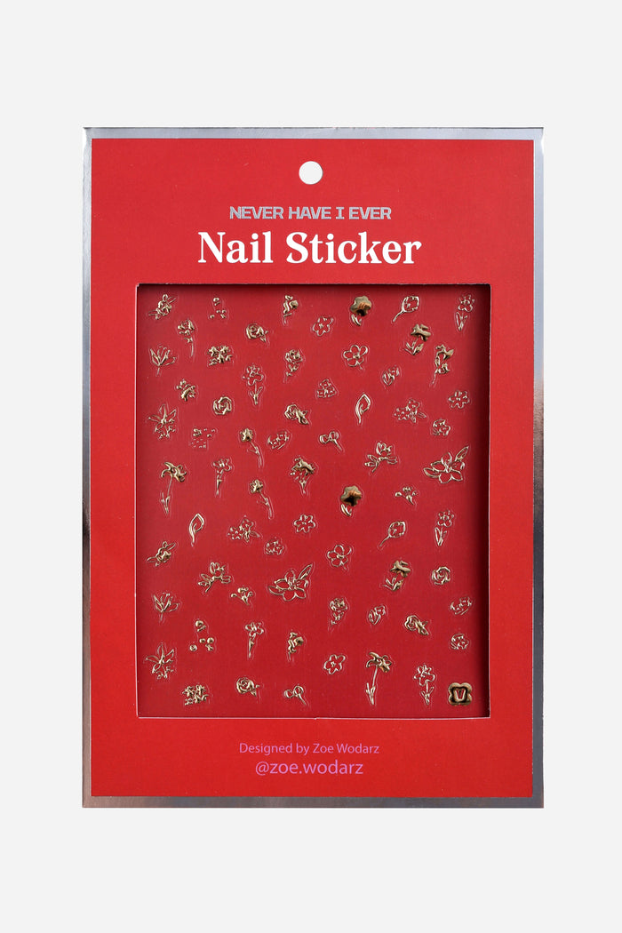 Gold floral nail stickers by Zoe Wodarz on a red backing card.