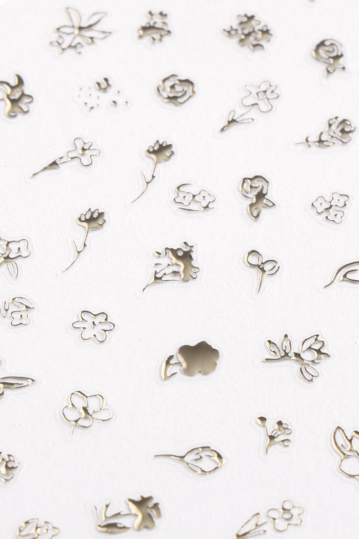 Gold floral and nature-inspired nail stickers by Zoe Wodarz.
