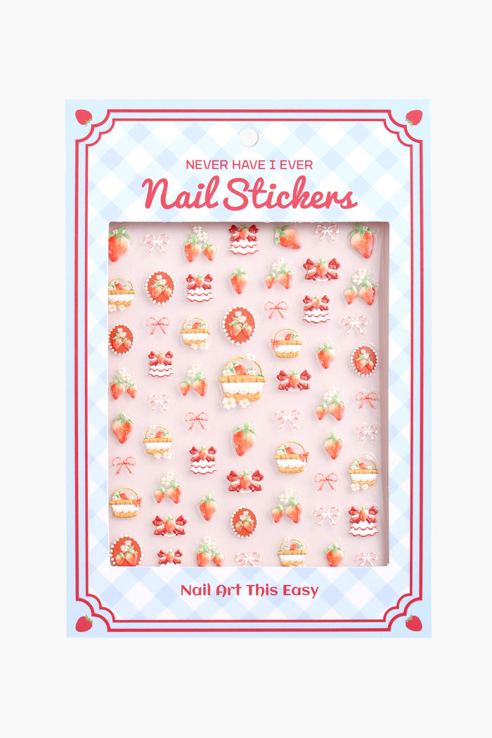 Sheet of 'Strawberries N Creme' nail stickers featuring various strawberry and dessert designs on a pink background.