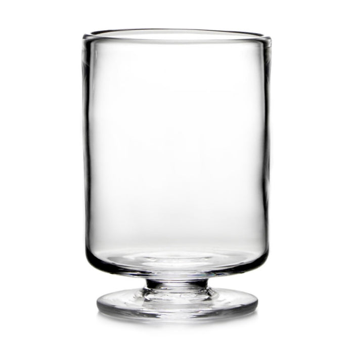 Clear glass hurricane vase with pedestal base and straight cylindrical sides.
